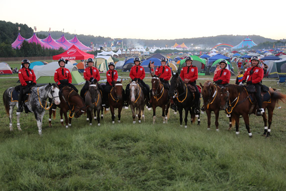 A&O Troopers at TomorrowWorld pose over the vast campground where they patrolled.