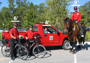 Riders, horses and truck